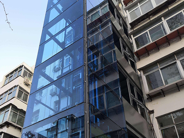 加裝電梯為什么不宜采用沈陽玻璃幕墻？